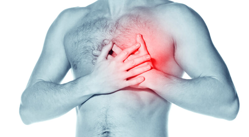 Man holding left side of chest in pain (highlighted in red)